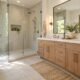 Modern bathroom with a glass walk-in shower and wooden double vanity