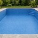 Empty backyard swimming pool with a smooth new blue vinyl liner